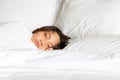 Only show face woman in white blanket tucked sleep on the bed Royalty Free Stock Photo