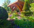 An show garden with flowers and trees at the Chelsea Flower Show in London