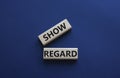 Show regard symbol. Wooden blocks with words Show regard. Beautiful deep blue background. Business and Show regard concept. Copy