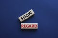 Show regard symbol. Wooden blocks with words Show regard. Beautiful deep blue background. Business and Show regard concept. Copy