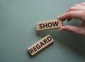 Show regard symbol. Wooden blocks with words Show regard. Beautiful grey green background. Businessman hand. Business and Show