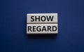 Show regard symbol. Wooden blocks with words Show regard. Beautiful deep blue background. Business and Show regard concept. Copy