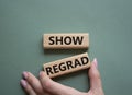 Show regard symbol. Wooden blocks with words Show regard. Beautiful grey green background. Businessman hand. Business and Show