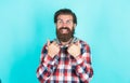 Show thumb up. mature bearded man in plaid shirt. handsome man wearing checkered shirt on yellow background. male beauty