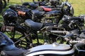 Collection of old motorcycles in England in the summer.