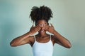 Show your fro, no more hiding your natural beauty. Studio shot of a beautiful, fresh faced young woman posing against a