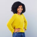 Show yourself how great you are. Studio shot of a confident young woman posing against a grey background.