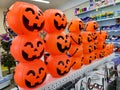 showcase with bright orange color plastic halloween pumpkin lanterns in shop in Novosibirsk, Russia 23 october 2022