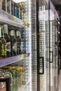 Showcase with chilled beer in the store. Close-up. Moscow, Russia, 12-24-2020. Vertical