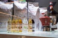Showcase of a coffee shop with selective focus on the row of syrups bottles Monin. Minsk, Belarus, 2023