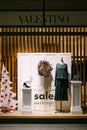 Showcase decoration of a fashion boutique, Valentino brand, in white for the Christmas holidays.