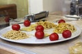 Showcase with different types of pasta and cherry tomatoes