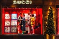 Showcase of Gucci store in Paris in the evening - Luxury shopping concept