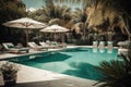 Showcase a luxurious pool area with all the amenities, such as cushy lounge chairs, umbrellas, and a bar with tropical drinks. The Royalty Free Stock Photo