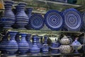 A showcase with oriental ceramics of blue color. Ceramic decorative plates, Blue and white ceramic plate Royalty Free Stock Photo