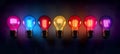 Showcase of seven distinct lightbulbs, each emitting a unique and vibrant color, set against a dark background.