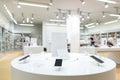 Showcase with smartphones in the modern electronics store. Buy a mobile phone