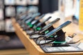 Showcase with smartphones in the modern electronics store. Royalty Free Stock Photo