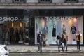 Showcase store Top Shop on the Strand. People stand near the win