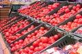 Showcase with tomatoes in a supermarket. A lot of red tomato. The choice of products. vegetables