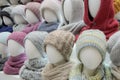 Showcase of trade tent with a variety of women`s hats for the autumn and winter seasons Royalty Free Stock Photo