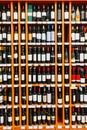 Showcase With Wine Bottles At The Wine Store. Wall With Alcoholic Drinks Wine Bottles On Shelves Royalty Free Stock Photo