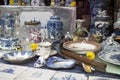 Showcases of Dutch shops with blue typical dishes and skulls