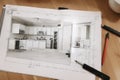 Computer Tablet Showing Kitchen Illustration Sitting On House Plans With Pencil and Compass. Royalty Free Stock Photo