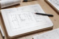 Computer Tablet Showing Kitchen Illustration Sitting On House Plans With Pencil and Compass. Royalty Free Stock Photo