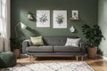 Creative composition of stylish and cozy room interior design with green wall with poster, toys, bright carpet, bottle green sofa