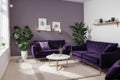 Livingroom interior wall mock up with violet velvet sofa, plant in vase and coffee table on empty white background. ing. Royalty Free Stock Photo