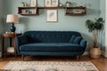Stylish room with elegant retro sofa and vintage bookshelf