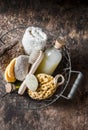 Shower accessories in vintage basket - shampoo, sponge, soap, facial brush, towel, washcloth, pumice stone. Natural beauty care pr Royalty Free Stock Photo