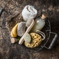 Shower accessories in vintage basket - shampoo, sponge, soap, facial brush, towel, washcloth, pumice stone. On wooden background Royalty Free Stock Photo