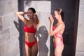 Shower On Beach. Two Beautiful Fit Woman Taking Shower At Swimming Pool. Girls With Body In Swimsuit Showering Royalty Free Stock Photo