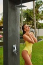 Shower On Beach. Woman In Swimsuit Showering At Pool Shower. Royalty Free Stock Photo