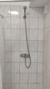 Shower in a cheap hostel or student dormitory bathroom Royalty Free Stock Photo