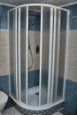Shower cubicle with white and blue tiles Royalty Free Stock Photo