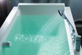 Shower filling a bathtub with water stream Royalty Free Stock Photo