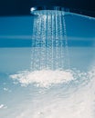 Shower filling a bathtub with water stream Royalty Free Stock Photo