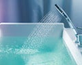 Shower filling a bathtub with water stream Royalty Free Stock Photo