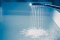 Shower filling a bathtub with water stream Royalty Free Stock Photo