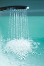 Shower filling a bathtub with water stream Royalty Free Stock Photo