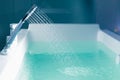 Shower filling a bathtub with water stream Royalty Free Stock Photo