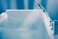 Shower filling a bathtub with water stream Royalty Free Stock Photo