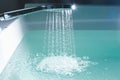 Shower filling a bathtub with water stream Royalty Free Stock Photo