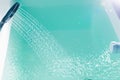 Shower filling a bathtub with water stream Royalty Free Stock Photo