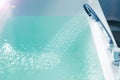 Shower filling a bathtub with water stream Royalty Free Stock Photo