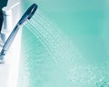 Shower filling a bathtub with water stream Royalty Free Stock Photo