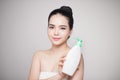 Shower gel. Joyful young woman advertising care product. Royalty Free Stock Photo